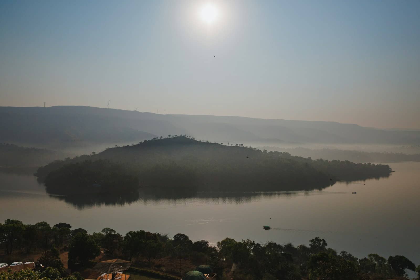Boating at sunrise on a hill-station lake