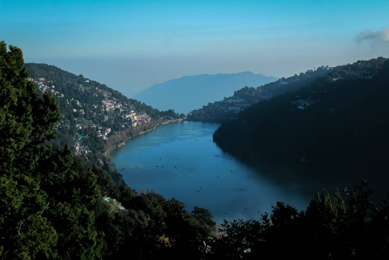 Misty lakeshore in the hills