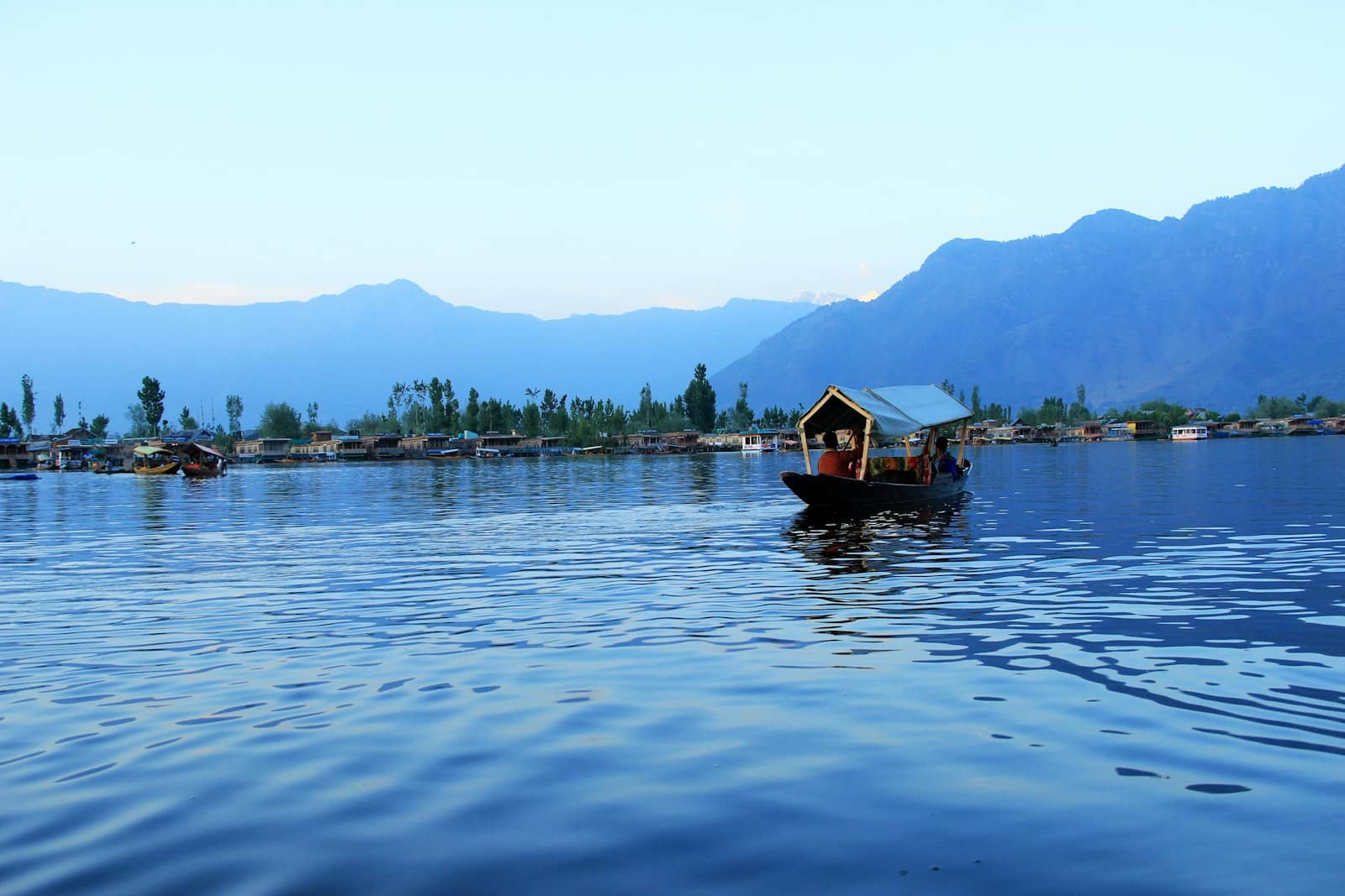 A rowing boat crossing a mountain lake