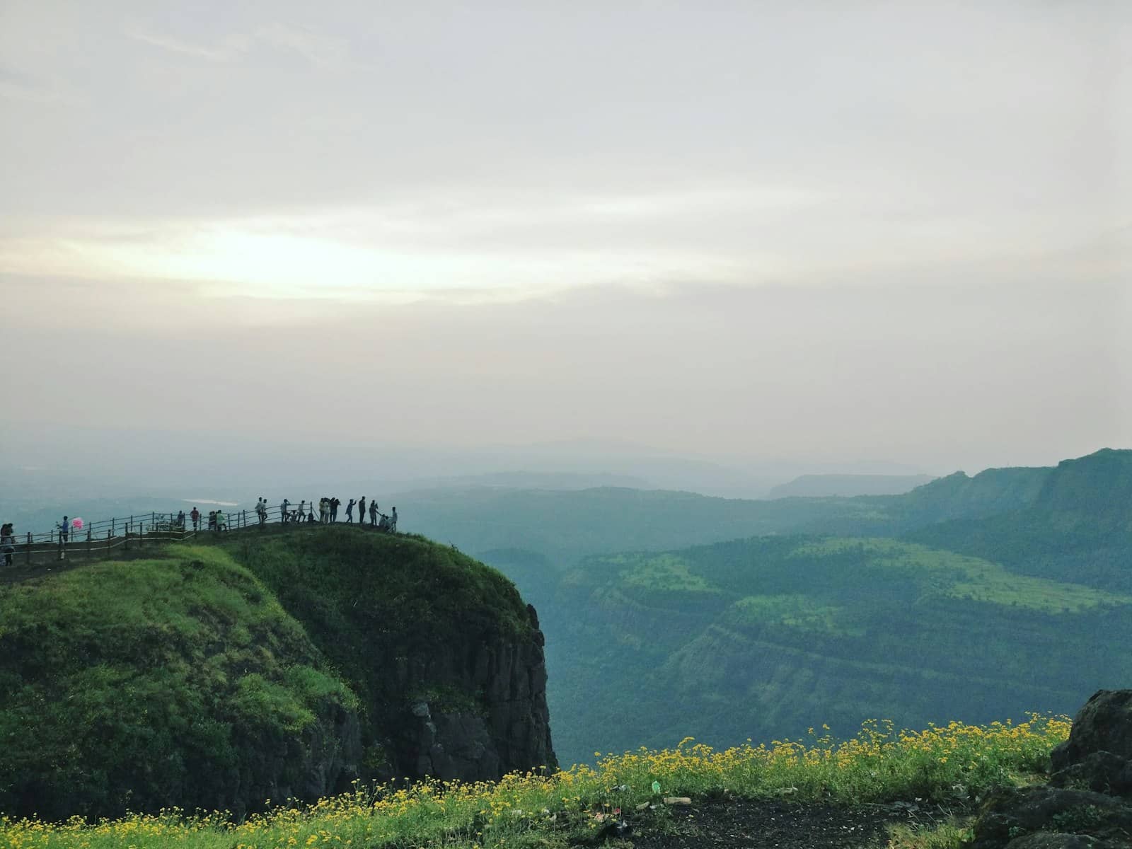 Hikers watching the sunrise from a viewpoint