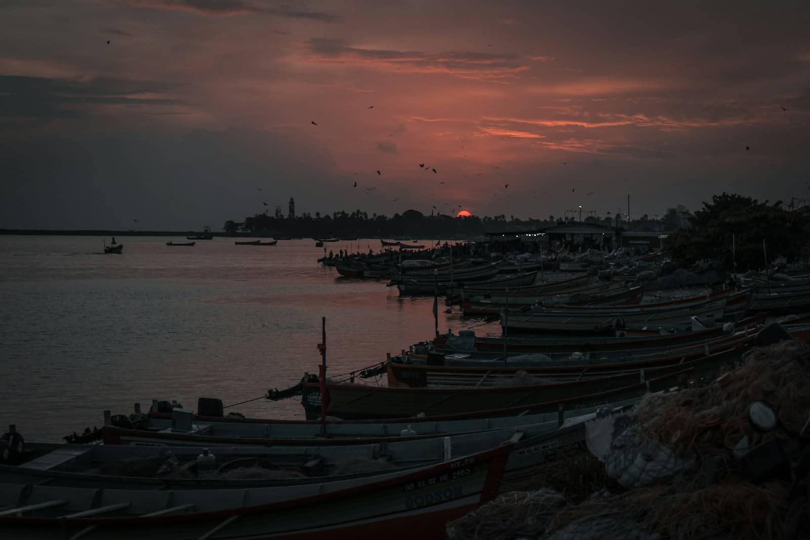Sunset over a lake with boats