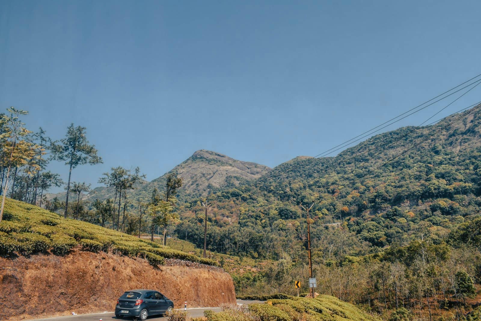 Chauffeur-driven car on a hill road
